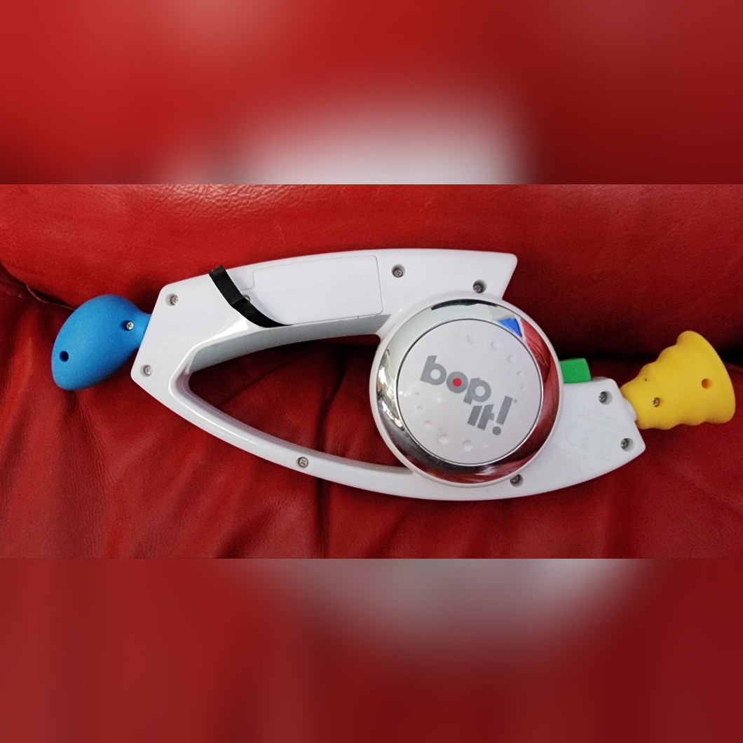 Bop It! Talking Handheld Electronic Reflex Game White Hasbro Benifits Charity